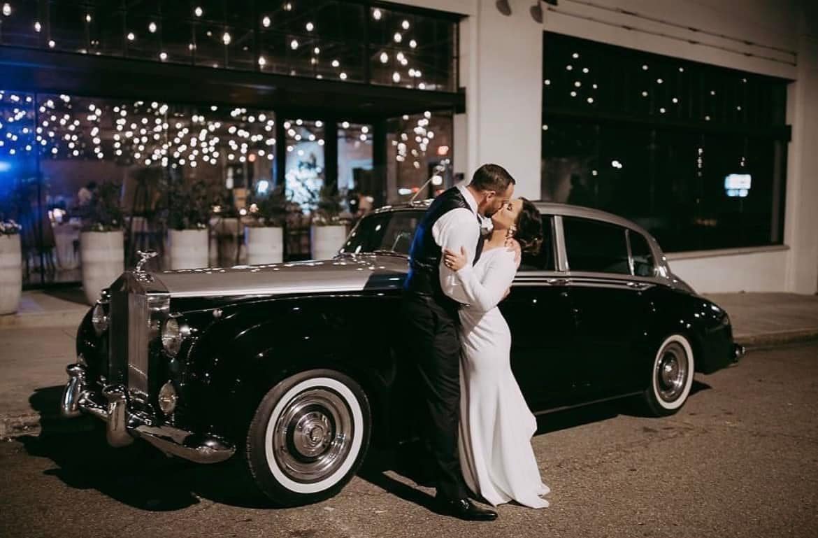 newly married couple in limousine